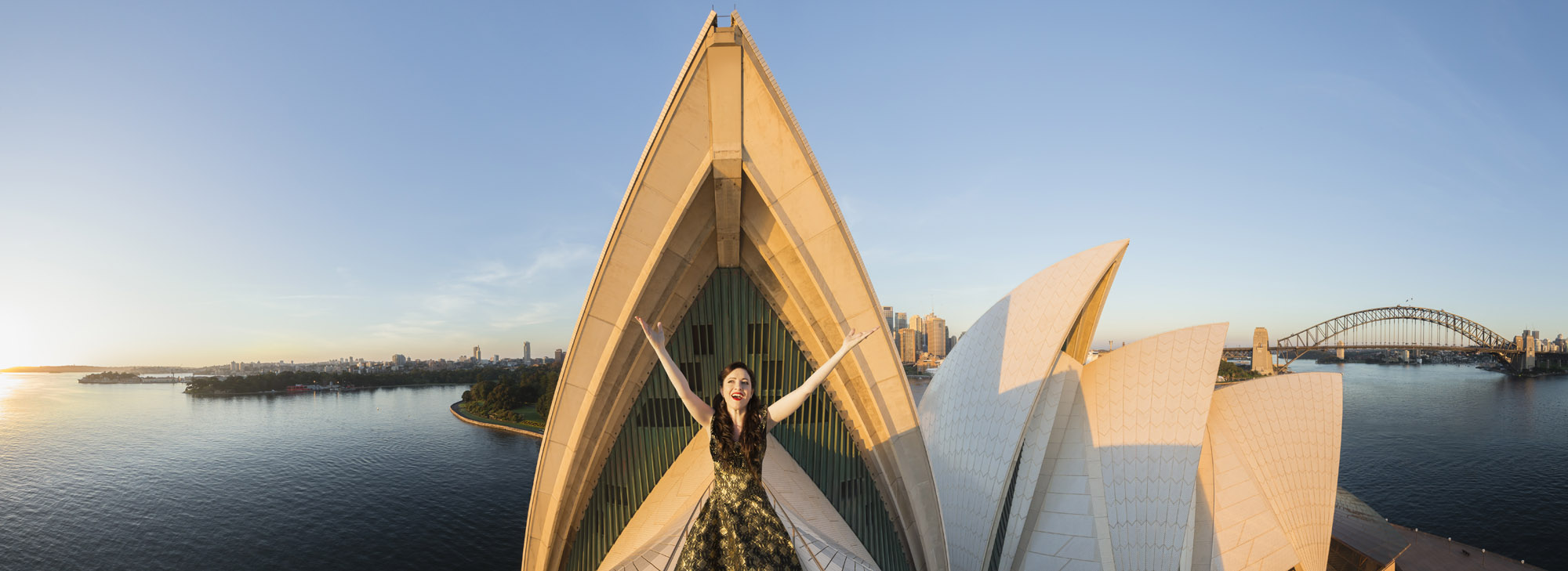 Lorina Gore at first light aloft the Sydney Opera House for Opera Australia
